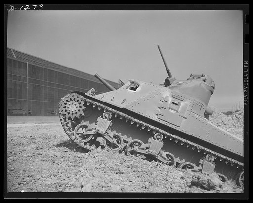 Chrysler tank arsenal. Testing is through at the proving grounds adjoining the Chrysler tank arsenal, near Detroit. This is one of the twenty-eight ton M-3 tanks, the steel monsters which will make our mechanized forces the equal of any in the world in tank warfare. The lower of the two barrels is t
