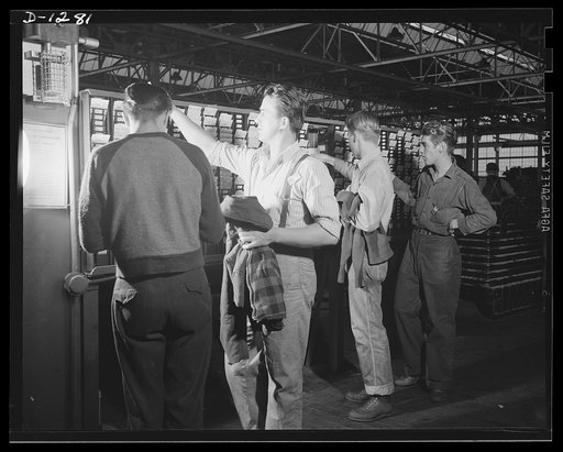 Chrysler tank arsenal. Another day's work done. These are workers at the huge Chrysler tank arsenal, near Detroit, where 10,000 men are producing M-3 tanks, twenty-eight ton rolling arsenals which promise to make Uncle Sam's mechanized forces the equal of any in the world in striking power