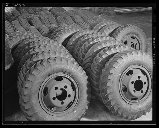 Army truck manufacture (Dodge). Spare wheels and tires by the hundreds for Army trucks are piled up in the Dodge Company's Lynch Road plant, in Detroit. Approximately 250 sets are required for each day's production. This makes a tremendous stock covering a huge arsenal at the plant