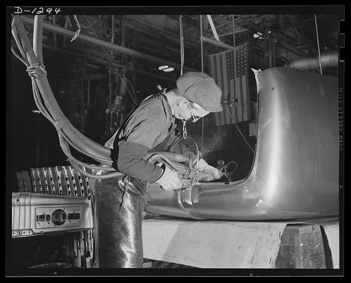 Army truck manufacture (Dodge). Experienced and skilled workers in the Dodge truck plant gun-welding the "strainers" or reinforcements to the top and back panels of Army trucks, to give the full measure of strength and rigidity required in strenuous Army service