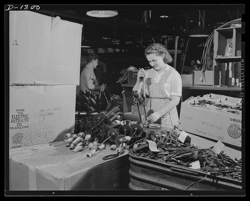 Army truck manufacture (Dodge). Women have an important part in defense industry of all kinds today, and the deft fingers of the girl shown above are effectively applied in the assembling of coils and switches for army trucks