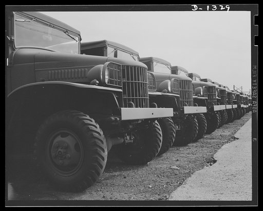 Army truck manufacture (Dodge). Line-up of U.S. Army trucks at the Dodge Lynch Road plant in Detroit, ready for shipment to Army posts throughout the country