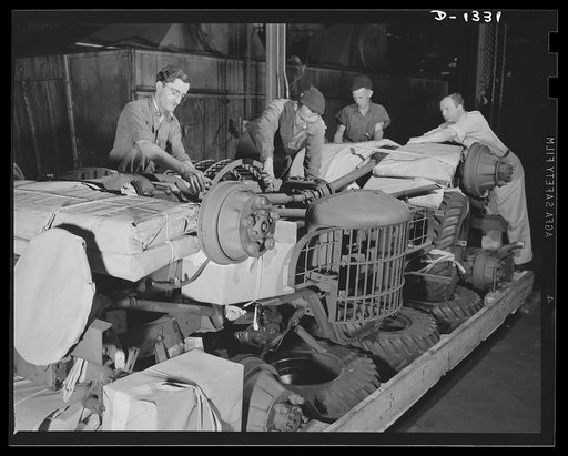 Army truck manufacture (Dodge). Crating Dodge Army trucks for overseas shipment. The trucks are shipped in lots of two, four or six to a box. When crates contain only two trucks, wheels and tires are included in the box, but where they are shipped in lots of four or more, there are separate boxes fo