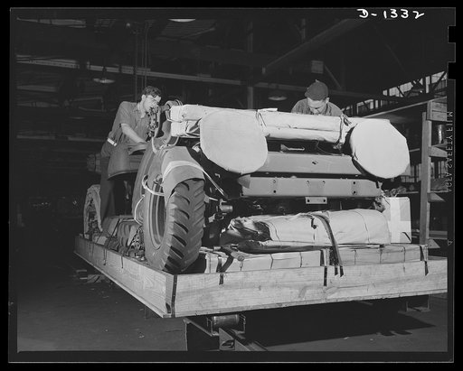 Army truck manufacture (Dodge). Crating Dodge Army trucks for overseas shipment. The trucks are shipped in lots of two, four or six to a box. When crates contain only two trucks, wheels and tires are included in the box, but where they are shipped in lots of four or more, there are separate boxes fo