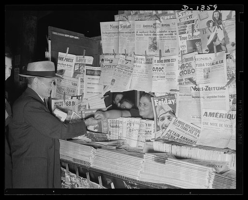 The four freedoms. No government censor passes on what may appear in these publications. Crowded newstands such as these, with journals representing every political party and every social theory are possible only in a democracy, where there is freedom of speech and of the press