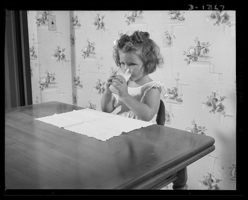 The four freedoms. It's serious business, this milk drinking. Maybe this youngster is thinking of the millions of youngsters in other lands who can never take their milk for granted