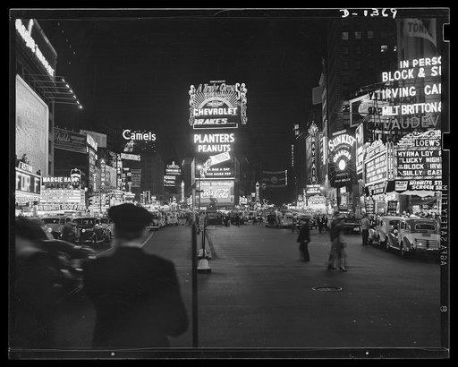 The four freedoms. No blackout at New York's famous Times Square, one of the few bright light sections of the world which has never been dimmed by threat of enemy bombers. Over to the left we see long may it wave