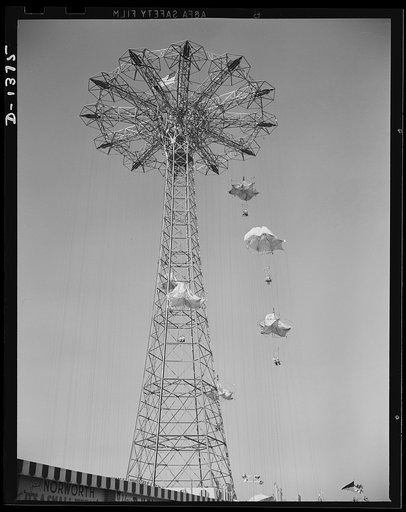 The four freedoms. Let'er rip, and carefree couples glide earthward from the top of Coney Island's famous parachute jump. Not shown are the milling crowds below, who enjoy the carefree screams of the people on the chutes as much as the brave chutists themselves
