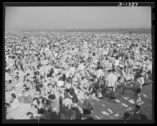The four freedoms. Pictures like this can be taken on the west, but not on the east coast of the Atlantic. These throngs of average Americans are at Coney Island beach, New York City. American beaches are not restricted "for military reasons"