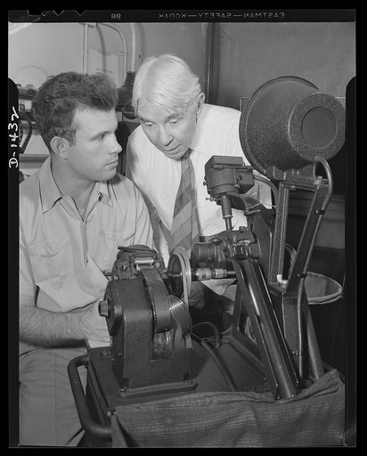 Poet and historian turns to films. Carl Sandburg, famous poet and Pulitizer prize winning historian has turned movie maker. He has just written the commentary for "Bomber," national defense motion picture produced by the Office of Emergency Management (OEM) film unit.  He is shown here in the cuttin