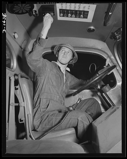 Civilian defense. This overhead switch controls the output of a 110-volt direct current generator, operating at 10 kilowatts to supply power to provide power for the two searchlights on the roof of the huge Emergency Service truck. There are also several auxilliary lights runs out from the truck and