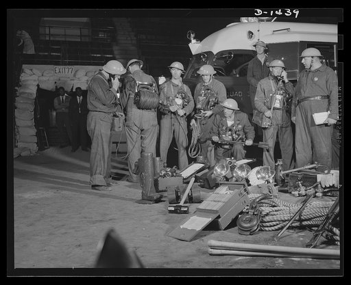 Civilian defense. Here are some of the tools which will speed civilian defense work in New York. In the foreground is an outlet junction box, which distributes electric current from an Emergency Service truck over a wide area. Then there are floodlights, all sorts of firefighting tools and equipment