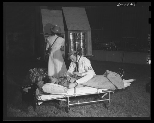 Civilian protection. Field emergency units of many characters will provide stretchers and carry first air equipment for field treatment of casualities. The "M.D." next to the caduceus on the doctor's armbank shows that he is a registered physician