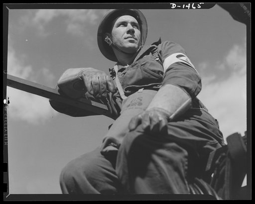 Civilian protection. A member of a bomb removal squad takes a well deserved rest from his danger-packed routine