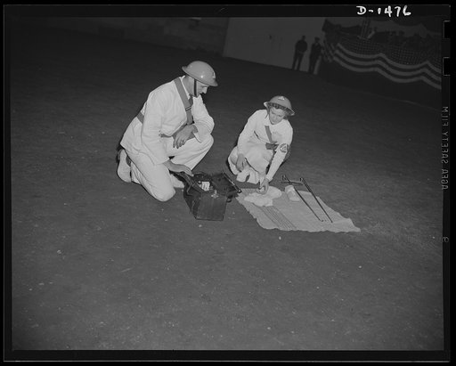Civilian defense. A doctor and a nurse, are setting up an emergency first aid station. Four such teams travel in the ambulance, set up a station and work out from it. Thier work was shown at the huge civilian defense show held in October at Madison Square Garden, New York