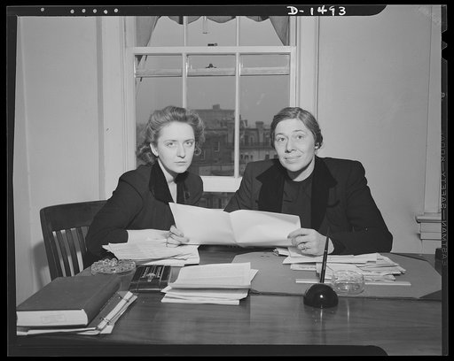Left, Miss Dorothy Overlock; and right, Mrs. Betty Lindley, Office of Civilian Defense
