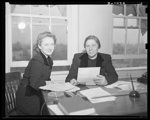Left, Miss Dorothy Overlock; and right, Mrs. Betty Lindley, Office of Civilian Defense
