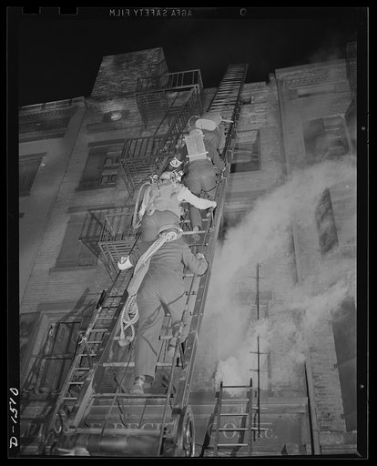 Civilian protection. Fully equipped to cope with whatever difficulties they may encounter, these New York City volunteer auxiliary firemen workers are climbling up a fire ladder to the roof of a building struck by bombs. Fartherest up the ladder is a worker equipped with an "Indian" fire pump, valua