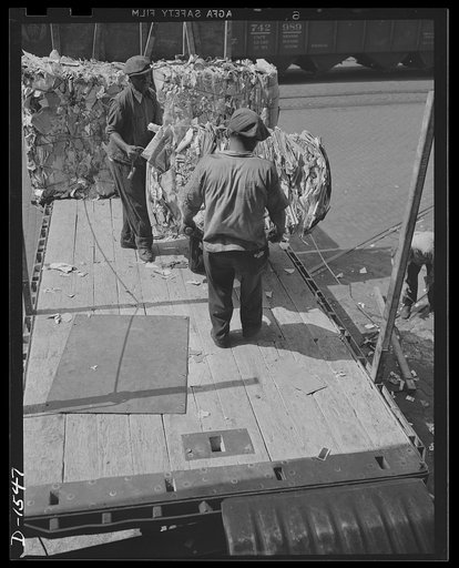 Waste paper. Packing boxes for defense products will be made from this load of waste paper. It has just then been delivered to a Philadelphia paper mill, where it will be chopped up. Combined with water and rolled out into the pasteboard packing materials so badly needed for shipment of our own defe