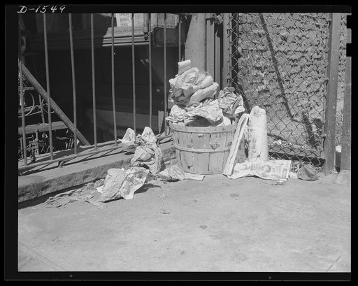 Waste paper. Destined for destruction, this household rubbish heap contains waste paper so badly needed today for conversion into the paper packing in which defense and lend-lease goods are shipped. Paper is one of the materials with which Americans have been most profligate, only now they are begin