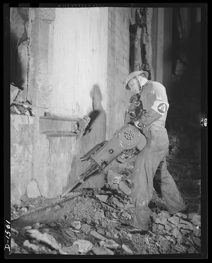 Civilian protection. A member of the rescue squad prepared to breach a concrete wall and take out victims of a bomb