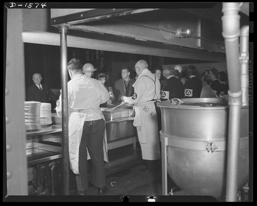 Civilian protection. Emergency feeding and housing corps is on the job feeding other civilian defense workers