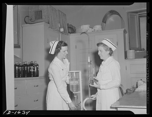Nurse instructor, left, shows "refresher course" student the new Wagenstein apparatus in use in post operative cases. Retired nurses brush up on latest techniques through this course before again going on active duty