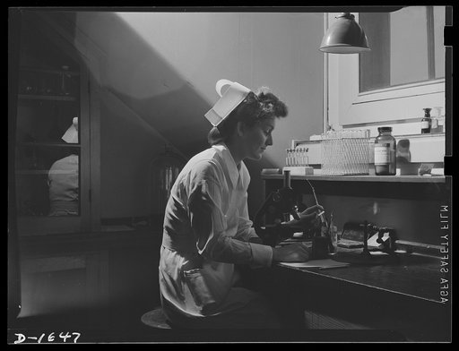Laboratory courses form an interesting part of the student nurse's training. Here a young student prepare a glass slide for microscopic study