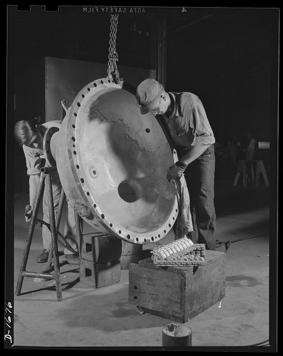 Shipbuilding (Newport News) These skilled workers are tinpleting an evaporator top, part of a stream turbine which will help to drive a news naval vessel under construction at the Newport News ways