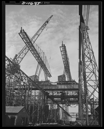 Shipbuilding (Newport News). Huge overhead cranes are used for the placing of heavy parts in the naval ships under construction at these ways. The setting up of the scaffolding and other structures for shipbuilding is in itself a major project