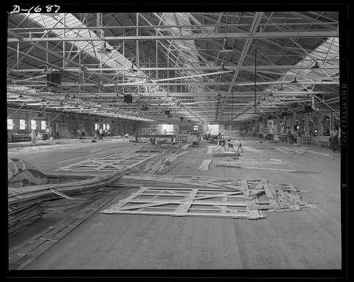 Shipbuilding (Newport News). These are mold loft workers laying out patterns for various parts of naval vessels under constructions. These patterns are subsequently transferred to steel