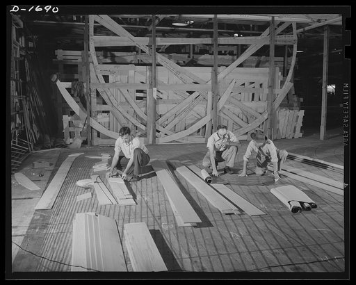 Shipbuilding (Newport News). These are mold loft workers laying out patterns for various parts of naval vessels under construction. These patterns are subsequently transferred to steel
