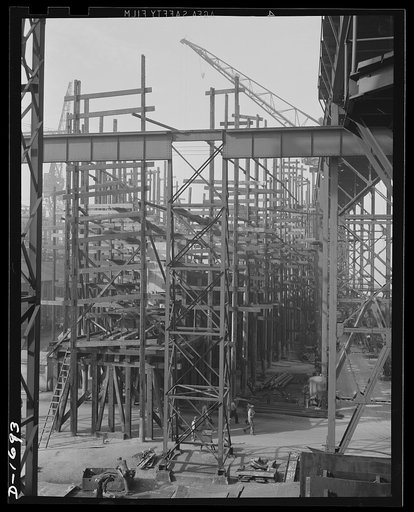 Shipbuilding (Newport News). Behind all the scaffolding a new cruiser is beginning to take shape, one of four under construction on the Newport News ways
