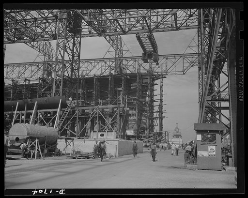 Shipbuilding (Newport News). Through the scaffolding may be seen the prow of a battleship under construction. The Norfolk-Newport News section of Virginia is contributing a large portion of the new tonnage of our rapidly expanding two-ocean Navy