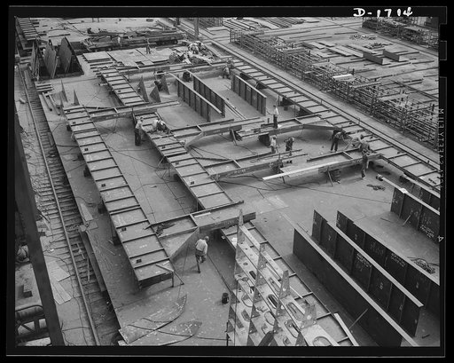 Shipbuilding (Newport News). This is a structural section, where preliminary work is done before the sections for new naval vessels are brought by overhead carriers to the ways, where they will become a part of the assembled ship