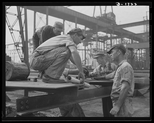 Shipbuilding (Newport News). Problems, major and minor, arise at every turn in the building of huge whips for Uncle Sam's growing Navy. In the foreground are structural section foremen working out one of their problems