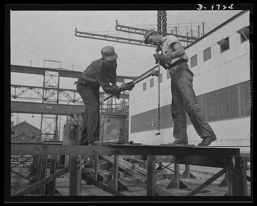 Shipbuilding (Newport News). These workers are red-leading a pipe, to prevent corrosion. Only the highest quality materials will serve for the new warcraft under construction for Uncle Sam's two-ocean fleet