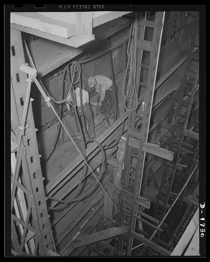 Shipbuilding (Norfolk Navy Yard). These men are putting in some of the hundreds of thousands of rivets on the huge 70 milion dollar battleship U.S.S. Alabama, under construction at the Norfolk Yard. The ship is scheduled for launching in February 1942