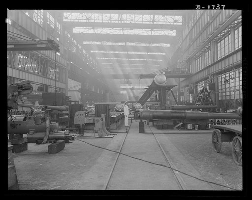 Shipbuilding (Norfolk Navy Yard). Huge naval guns are assembled in the gun shop for installation on the warcraft being built here for Uncle Sam's growing Navy