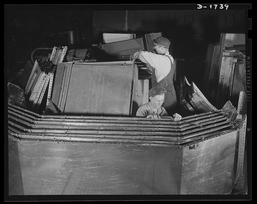 Shipbuilding (Norfolk Navy Yard). These workers are punching stainless steel for use in galleys and mess rooms in naval craft under construction at Norfolk