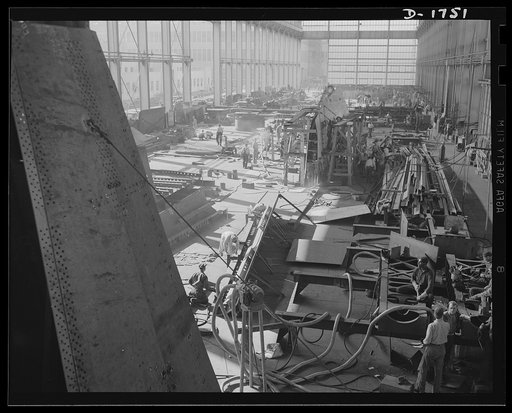 Shipbuilding (Norfolk Navy Yard). Hundreds of skilled workers are engaged in the welding shop. Welded jointures have many advantages over riveted fittings, and welders are sought in increasing quantities for work on Uncle Sam's growing battle fleet