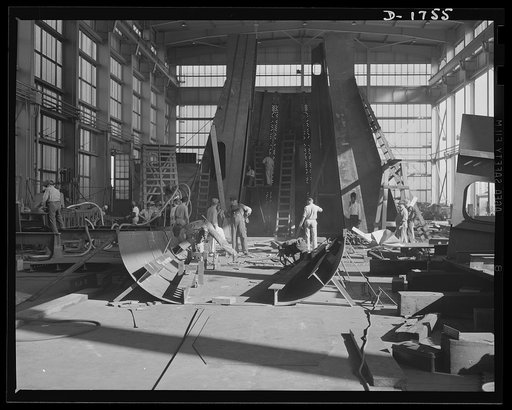Shipbuilding (Norfolk Navy Yard). Hundreds of skilled workers are engaged in the welding shop. Welded jointures have many advantages over riveted fittings, and welders are sought in increasing quantities for work on Uncle Sam's growing battle fleet