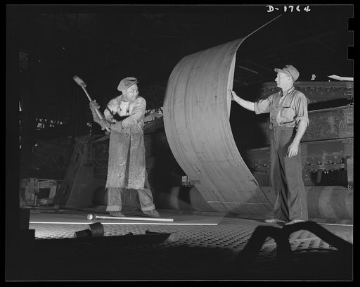 Shipbuilding (Norfolk Navy Yard). Manpower for defense is the specialty of the worker with the sledge hammer, about to pound a ship's plate. The sledge hammer is still an important tool in the production of Uncle Sam's new battle fleet