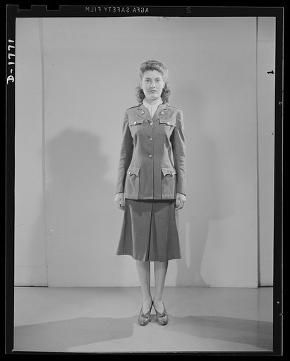 Civilian defense uniforms. Winter "parade." This girl is wearing the Motor Corps Insignia