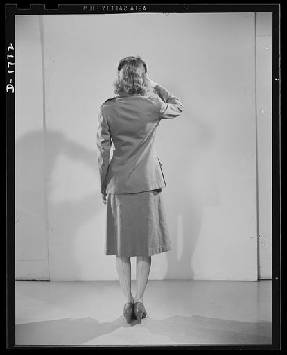 Civilian defense uniforms. Winter "parade." This girl is wearing the Motor Corps Insignia