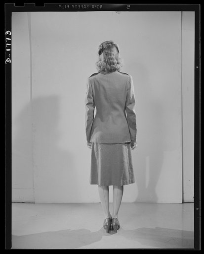 Civilian defense uniforms. Winter "parade." This girl is wearing the Motor Corps Insignia