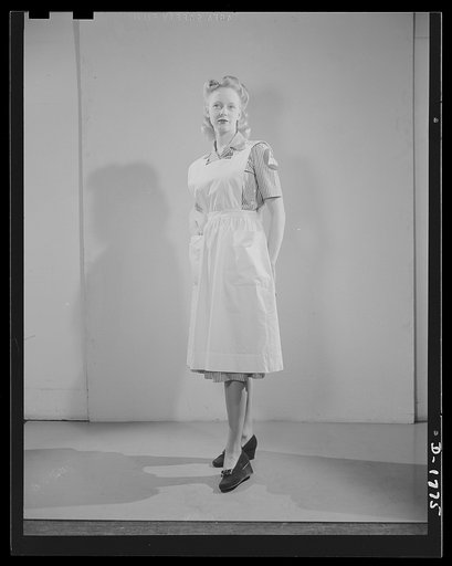 Civilian defense uniforms. Hospital assistant. White stripe on red. Insignia white triangle on blue circle
