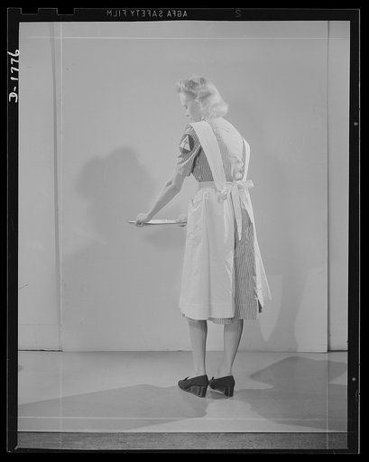 Civilian defense uniforms. Hospital assistant. White stripe on red. Insignia white triangle on blue circle