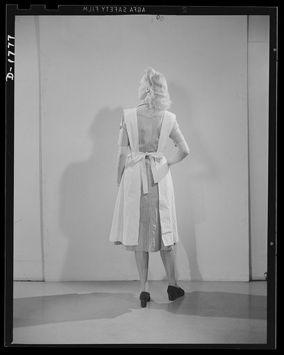 Civilian defense uniforms. Hospital assistant. White stripe on red. Insignia white triangle on blue circle