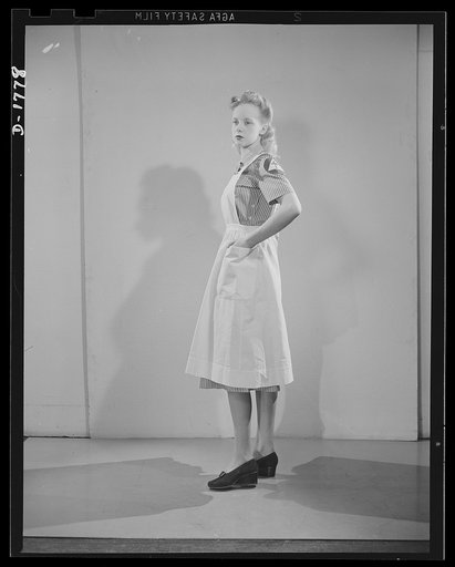Civilian defense uniforms. Hospital assistant. White stripe on red. Insignia white triangle on blue circle